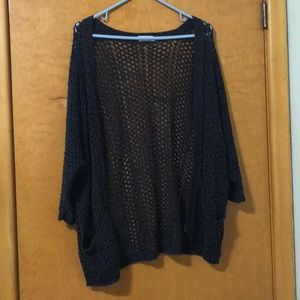 Black over sized, fishnet cardigan with pockets.